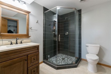 This beautiful 2-story home overlooks the par-3 4th hole at on Hunters Ridge Golf Course in Iowa - for sale on GolfHomes.com, golf home, golf lot