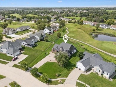 This beautiful 2-story home overlooks the par-3 4th hole at on Hunters Ridge Golf Course in Iowa - for sale on GolfHomes.com, golf home, golf lot