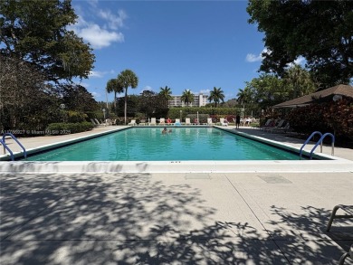 BEAUTIFUL GOLF COURSE VIEWS provide a serene environment for on Palm-Aire Country Club and Resort - Palms in Florida - for sale on GolfHomes.com, golf home, golf lot