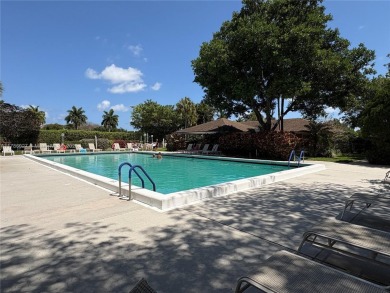 BEAUTIFUL GOLF COURSE VIEWS provide a serene environment for on Palm-Aire Country Club and Resort - Palms in Florida - for sale on GolfHomes.com, golf home, golf lot