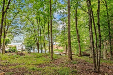 Located in the heart of the prestigious Great Waters community on Great Waters Course At Reynolds Plantation in Georgia - for sale on GolfHomes.com, golf home, golf lot