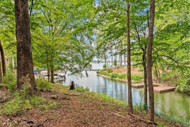 Located in the heart of the prestigious Great Waters community on Great Waters Course At Reynolds Plantation in Georgia - for sale on GolfHomes.com, golf home, golf lot