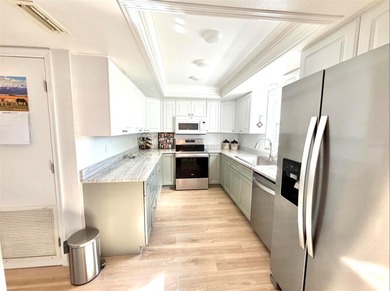 Charming and quiet 2-bedroom, 2-bath condo overlooking lush on Feather Sound Country Club in Florida - for sale on GolfHomes.com, golf home, golf lot