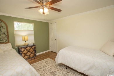 Just a short golf cart ride away from beautiful Garden City on Indigo Creek Golf Club in South Carolina - for sale on GolfHomes.com, golf home, golf lot