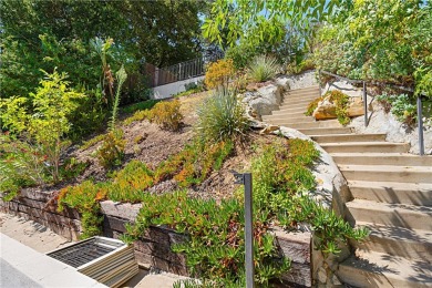 This modern hillside residence in Woodland Hills offers 4 on Woodland Hills Country Club in California - for sale on GolfHomes.com, golf home, golf lot