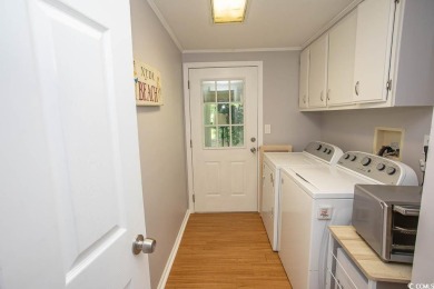 Just a short golf cart ride away from beautiful Garden City on Indigo Creek Golf Club in South Carolina - for sale on GolfHomes.com, golf home, golf lot