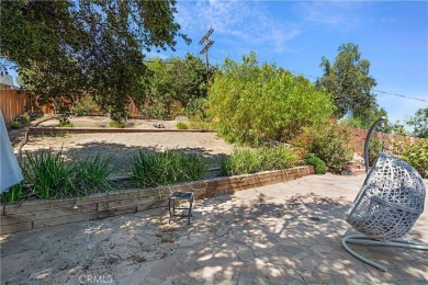 This modern hillside residence in Woodland Hills offers 4 on Woodland Hills Country Club in California - for sale on GolfHomes.com, golf home, golf lot