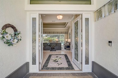 Discover refined living in this expansive Calusa Lakes estate on Calusa Lakes Golf Club in Florida - for sale on GolfHomes.com, golf home, golf lot