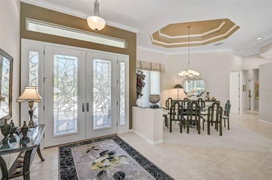Discover refined living in this expansive Calusa Lakes estate on Calusa Lakes Golf Club in Florida - for sale on GolfHomes.com, golf home, golf lot