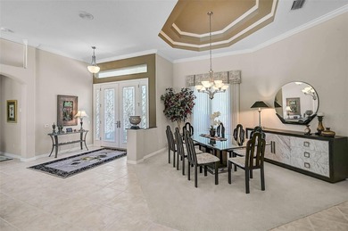 Discover refined living in this expansive Calusa Lakes estate on Calusa Lakes Golf Club in Florida - for sale on GolfHomes.com, golf home, golf lot