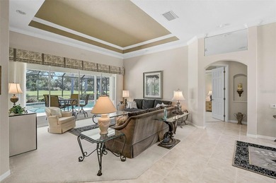Discover refined living in this expansive Calusa Lakes estate on Calusa Lakes Golf Club in Florida - for sale on GolfHomes.com, golf home, golf lot