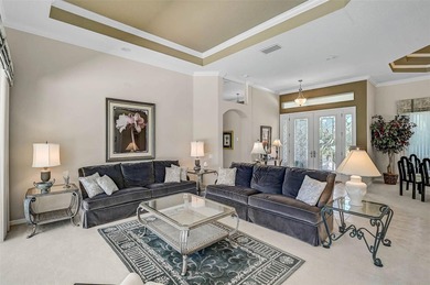Discover refined living in this expansive Calusa Lakes estate on Calusa Lakes Golf Club in Florida - for sale on GolfHomes.com, golf home, golf lot