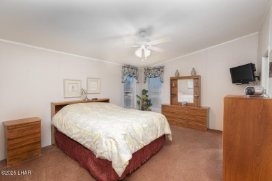 Step into this furnished 3-bedroom, 2-bath manufactured home on The Refuge Golf and Country Club in Arizona - for sale on GolfHomes.com, golf home, golf lot