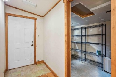 Endless Potential! Fixer-Upper Opportunity Close to Lake on Lake McBride Golf Course in Iowa - for sale on GolfHomes.com, golf home, golf lot
