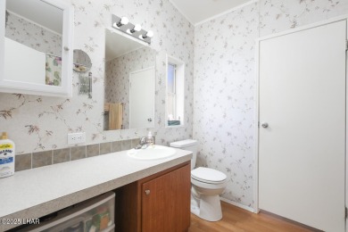 Step into this furnished 3-bedroom, 2-bath manufactured home on The Refuge Golf and Country Club in Arizona - for sale on GolfHomes.com, golf home, golf lot