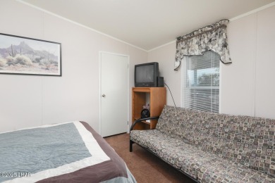 Step into this furnished 3-bedroom, 2-bath manufactured home on The Refuge Golf and Country Club in Arizona - for sale on GolfHomes.com, golf home, golf lot
