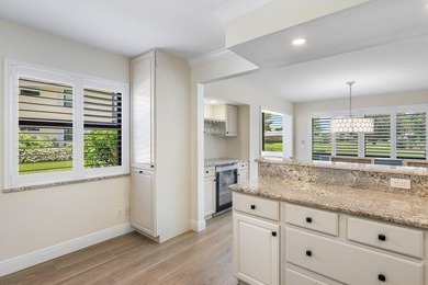 Experience the convenience of this renovated first-floor corner on Quail Ridge Golf Course and Country Club in Florida - for sale on GolfHomes.com, golf home, golf lot