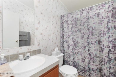 Step into this furnished 3-bedroom, 2-bath manufactured home on The Refuge Golf and Country Club in Arizona - for sale on GolfHomes.com, golf home, golf lot