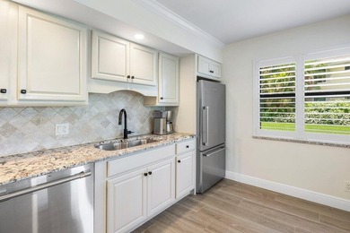 Experience the convenience of this renovated first-floor corner on Quail Ridge Golf Course and Country Club in Florida - for sale on GolfHomes.com, golf home, golf lot