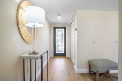 Experience the convenience of this renovated first-floor corner on Quail Ridge Golf Course and Country Club in Florida - for sale on GolfHomes.com, golf home, golf lot