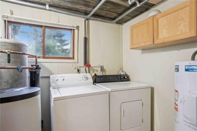 Endless Potential! Fixer-Upper Opportunity Close to Lake on Lake McBride Golf Course in Iowa - for sale on GolfHomes.com, golf home, golf lot