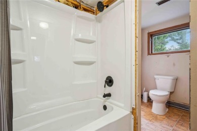 Endless Potential! Fixer-Upper Opportunity Close to Lake on Lake McBride Golf Course in Iowa - for sale on GolfHomes.com, golf home, golf lot