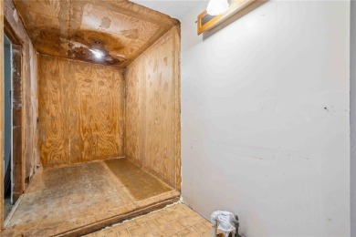 Endless Potential! Fixer-Upper Opportunity Close to Lake on Lake McBride Golf Course in Iowa - for sale on GolfHomes.com, golf home, golf lot
