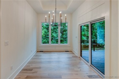 New Construction! This luxurious reverse  1.5 story 5 bedroom/3 on The Club At Porto Cima in Missouri - for sale on GolfHomes.com, golf home, golf lot