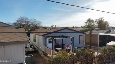 Step into this furnished 3-bedroom, 2-bath manufactured home on The Refuge Golf and Country Club in Arizona - for sale on GolfHomes.com, golf home, golf lot