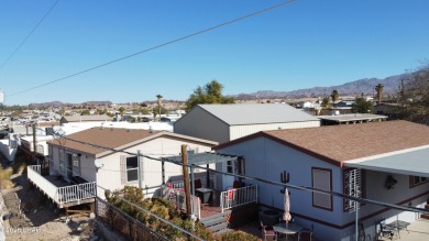 Step into this furnished 3-bedroom, 2-bath manufactured home on The Refuge Golf and Country Club in Arizona - for sale on GolfHomes.com, golf home, golf lot