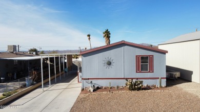 Step into this furnished 3-bedroom, 2-bath manufactured home on The Refuge Golf and Country Club in Arizona - for sale on GolfHomes.com, golf home, golf lot
