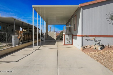 Step into this furnished 3-bedroom, 2-bath manufactured home on The Refuge Golf and Country Club in Arizona - for sale on GolfHomes.com, golf home, golf lot
