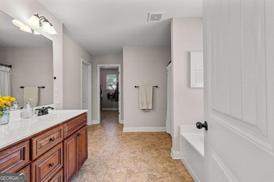 Beautiful four-bedroom, three-bath home located in the highly on Summergrove Golf Club in Georgia - for sale on GolfHomes.com, golf home, golf lot