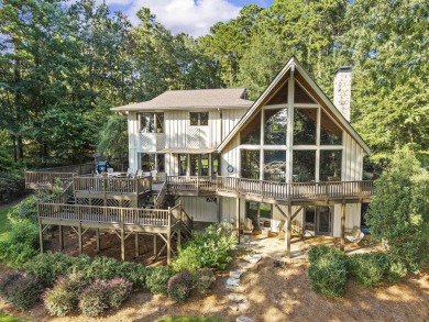 This beautifully maintained golf course home offers sweeping on Reynolds Lake Oconee - The Landing in Georgia - for sale on GolfHomes.com, golf home, golf lot