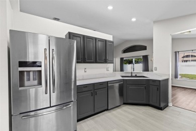 Step into this beautifully updated home, nestled in the scenic on Lexington Oaks Golf Club in Florida - for sale on GolfHomes.com, golf home, golf lot