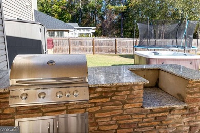 Beautiful four-bedroom, three-bath home located in the highly on Summergrove Golf Club in Georgia - for sale on GolfHomes.com, golf home, golf lot