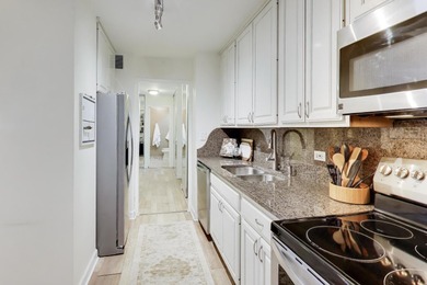 Discover this stunning east-facing balcony residence at Imperial on Sydney R. Marovitz Golf Course in Illinois - for sale on GolfHomes.com, golf home, golf lot