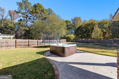 Beautiful four-bedroom, three-bath home located in the highly on Summergrove Golf Club in Georgia - for sale on GolfHomes.com, golf home, golf lot