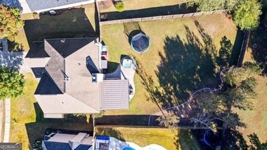 Beautiful four-bedroom, three-bath home located in the highly on Summergrove Golf Club in Georgia - for sale on GolfHomes.com, golf home, golf lot