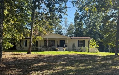 This sprawling brick ranch is in the perfect location! Minutes on Cherokee Golf and Country Club in Georgia - for sale on GolfHomes.com, golf home, golf lot