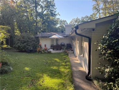 This sprawling brick ranch is in the perfect location! Minutes on Cherokee Golf and Country Club in Georgia - for sale on GolfHomes.com, golf home, golf lot