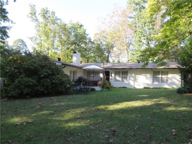 This sprawling brick ranch is in the perfect location! Minutes on Cherokee Golf and Country Club in Georgia - for sale on GolfHomes.com, golf home, golf lot