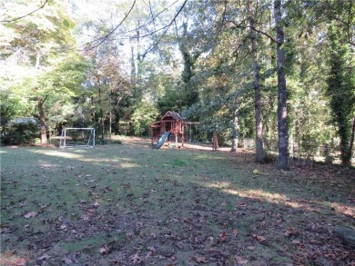 This sprawling brick ranch is in the perfect location! Minutes on Cherokee Golf and Country Club in Georgia - for sale on GolfHomes.com, golf home, golf lot