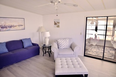 This lovely, 2/2 manufactured home on leased land in Lake on Pine Lakes Country Club in Florida - for sale on GolfHomes.com, golf home, golf lot