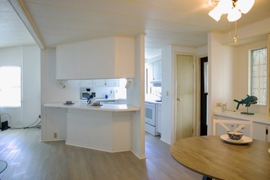 This lovely, 2/2 manufactured home on leased land in Lake on Pine Lakes Country Club in Florida - for sale on GolfHomes.com, golf home, golf lot