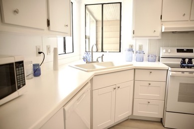 This lovely, 2/2 manufactured home on leased land in Lake on Pine Lakes Country Club in Florida - for sale on GolfHomes.com, golf home, golf lot