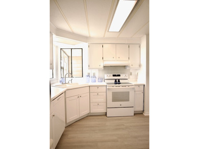 This lovely, 2/2 manufactured home on leased land in Lake on Pine Lakes Country Club in Florida - for sale on GolfHomes.com, golf home, golf lot