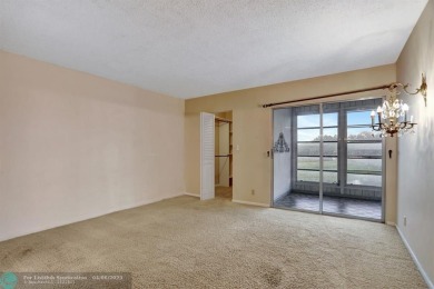 DRAMATICALLY REDUCED, SELLER IS MOTIVATED, Discover this on Wynmoor Golf Course in Florida - for sale on GolfHomes.com, golf home, golf lot