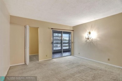 DRAMATICALLY REDUCED, SELLER IS MOTIVATED, Discover this on Wynmoor Golf Course in Florida - for sale on GolfHomes.com, golf home, golf lot