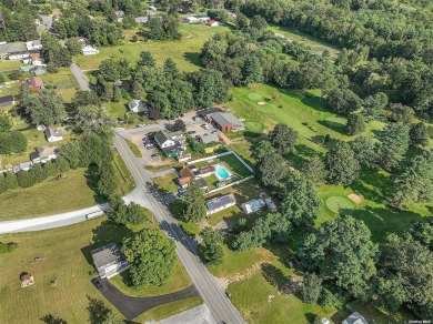 Welcome to this beautifully maintained home on a serene .39-acre on Sunnyside Par 3 Golf Course in New York - for sale on GolfHomes.com, golf home, golf lot